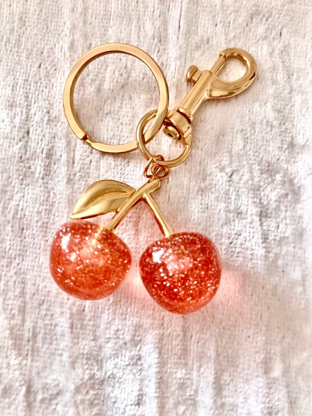 Glittering Pink Cherry Keychain with Gold Accents